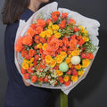 Sunshine Bouquet with orange and yellow roses and seasonal flowers