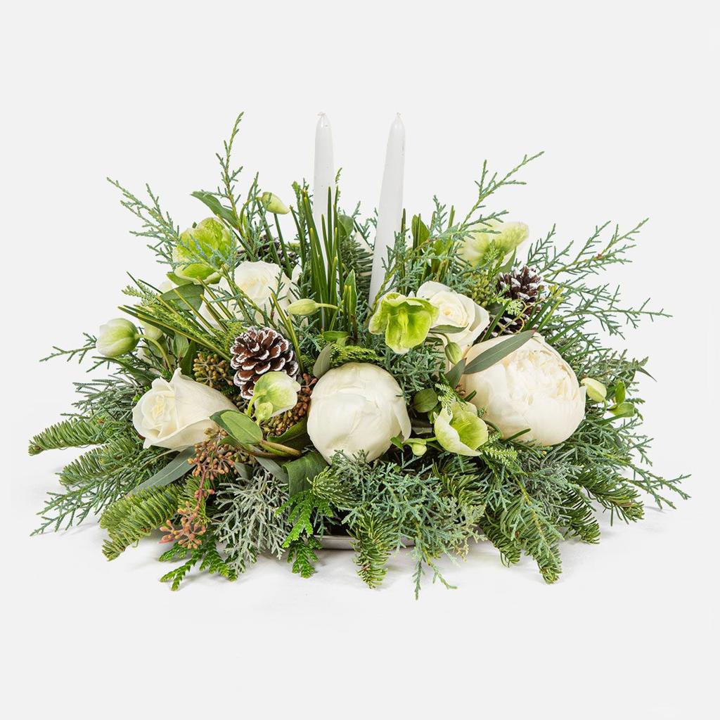 Winter Wonderland Centerpiece with white flowers, evergreen foliage and candles