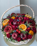 Pomegranate Harvest Basket with pomegranates and assorted seasonal fruit
